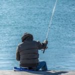 Fisherman Fishing Alone By the Water While Going Fishing
